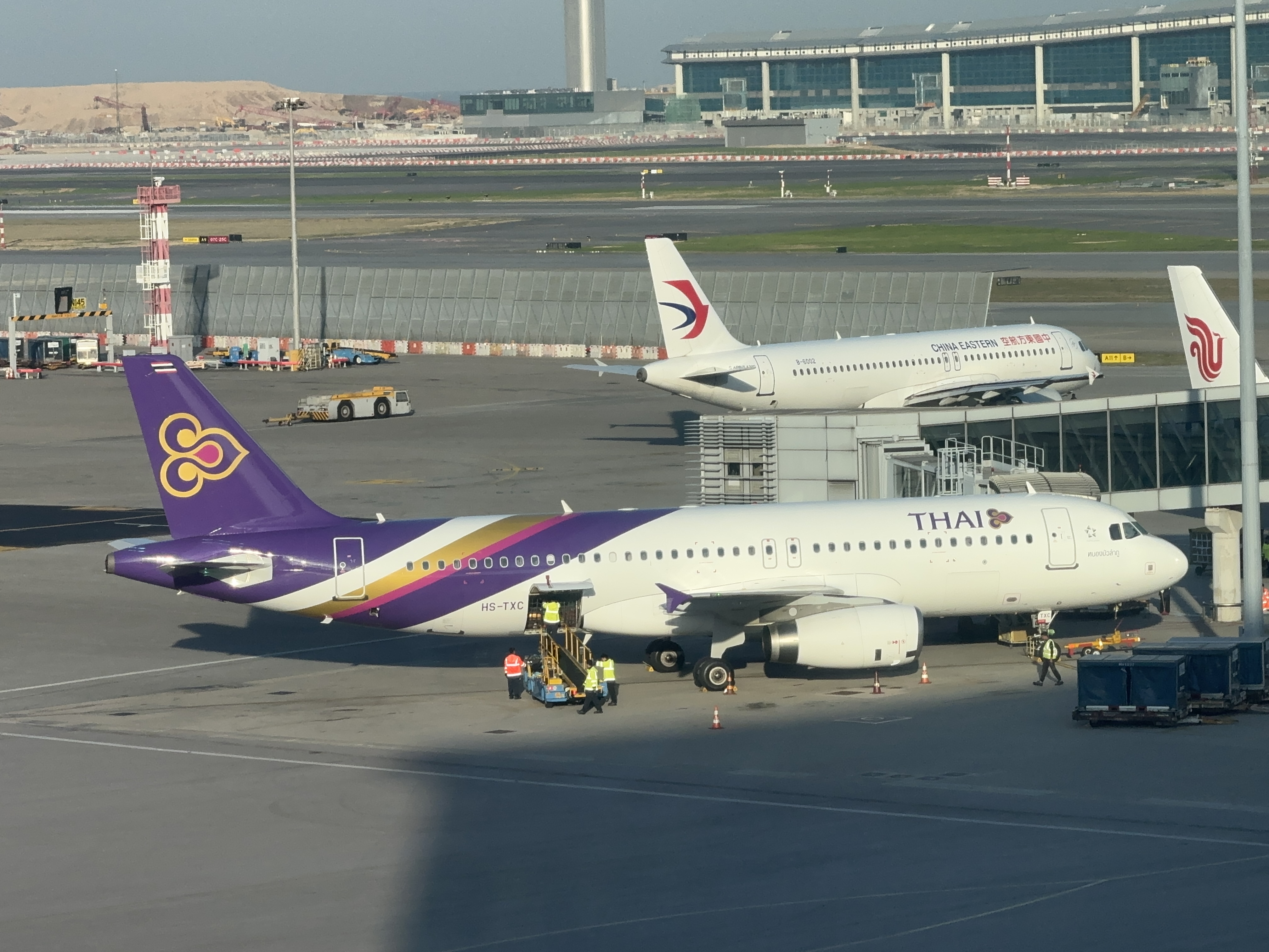Travelers waiting at Thai immigration checkpoints